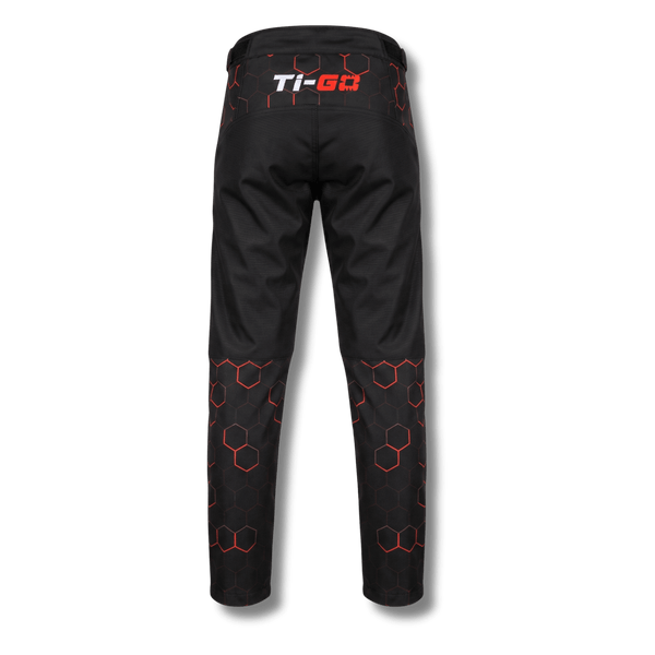 Back of Ti-GO kids MX, BMX & MTB riding pants in black & orange hex print