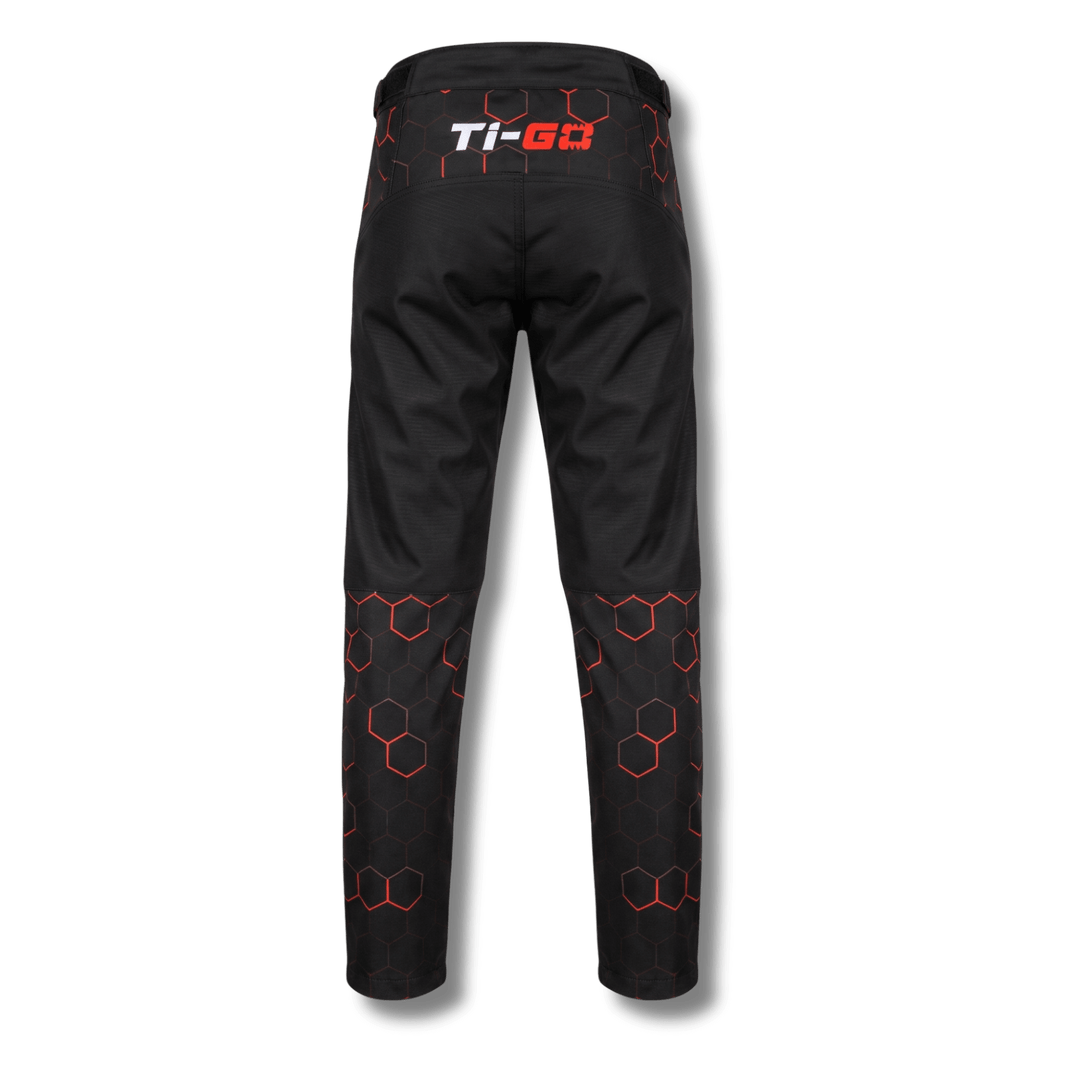 Back of Ti-GO kids MX, BMX &amp; MTB riding pants in black &amp; orange hex print